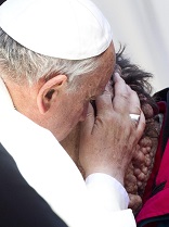 Image of Francis hugs the poor.